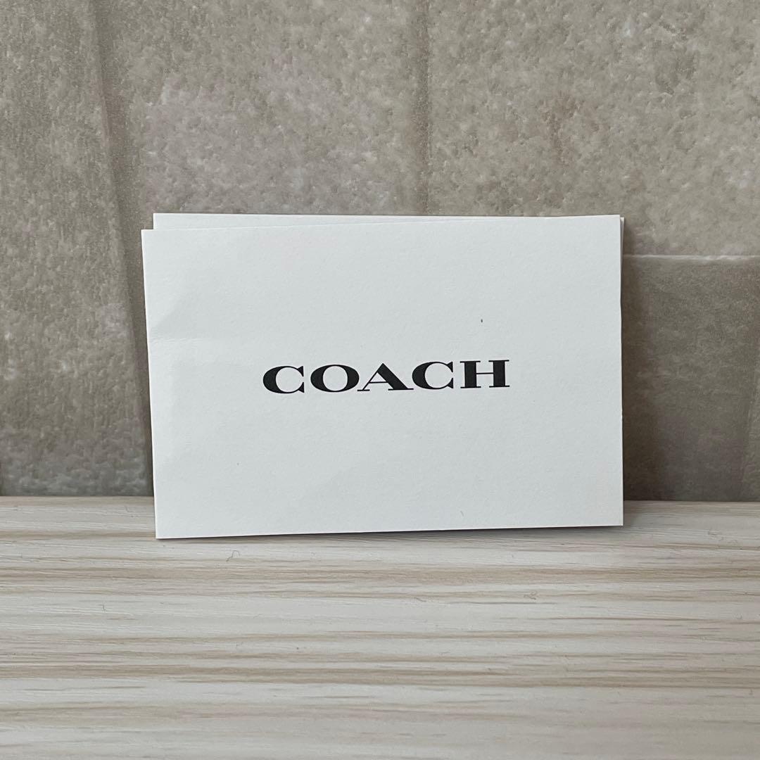 訳あり新品 COACH 二つ折り財布 シグネチャー総柄 茶色×水色