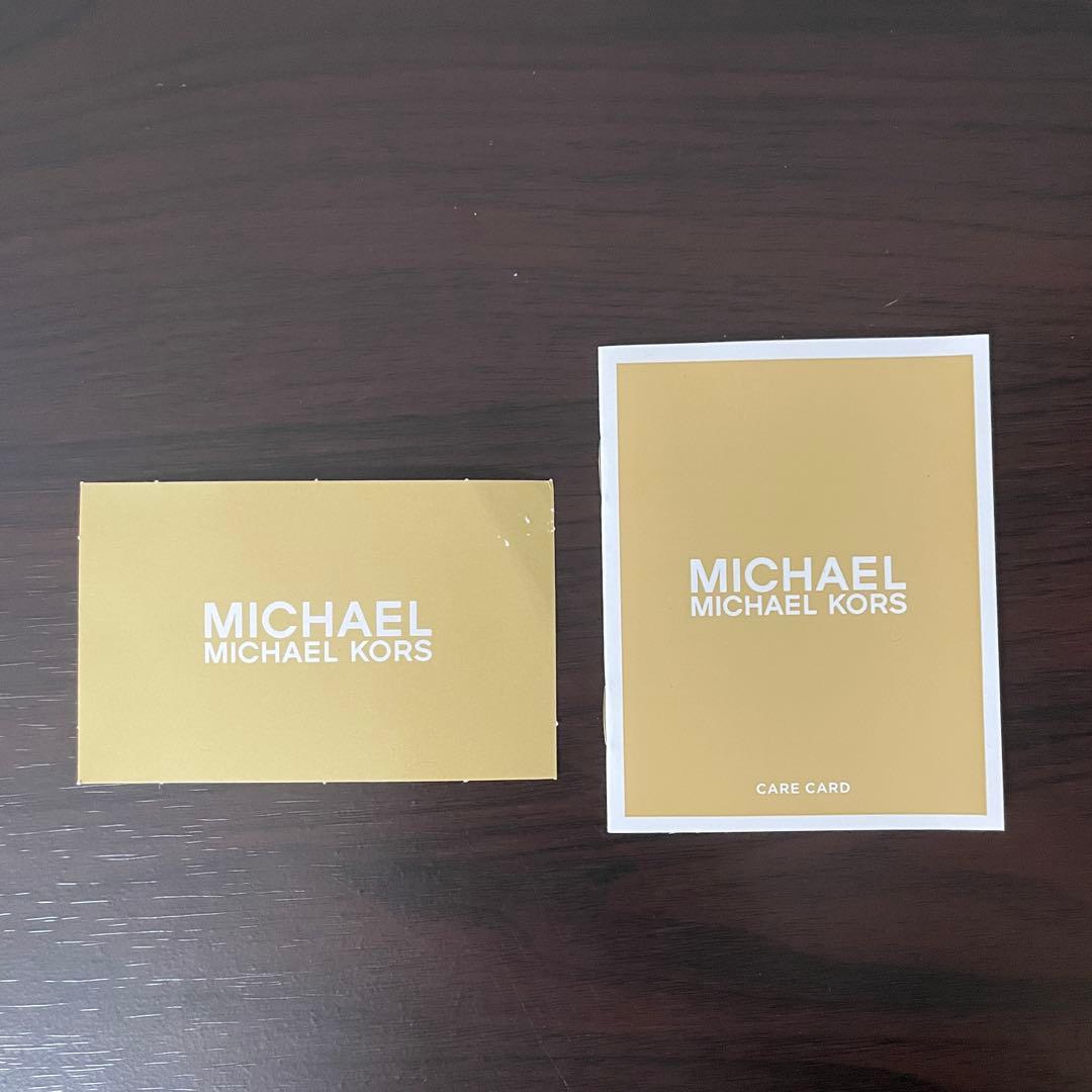 訳あり新品 MICHAEL KORS 二つ折り財布 シグネチャー柄