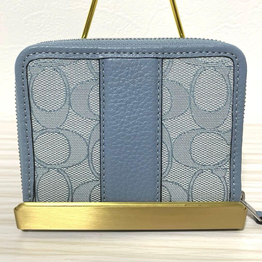 訳あり新品 COACH 二つ折り財布 ライトブルー シグネチャー