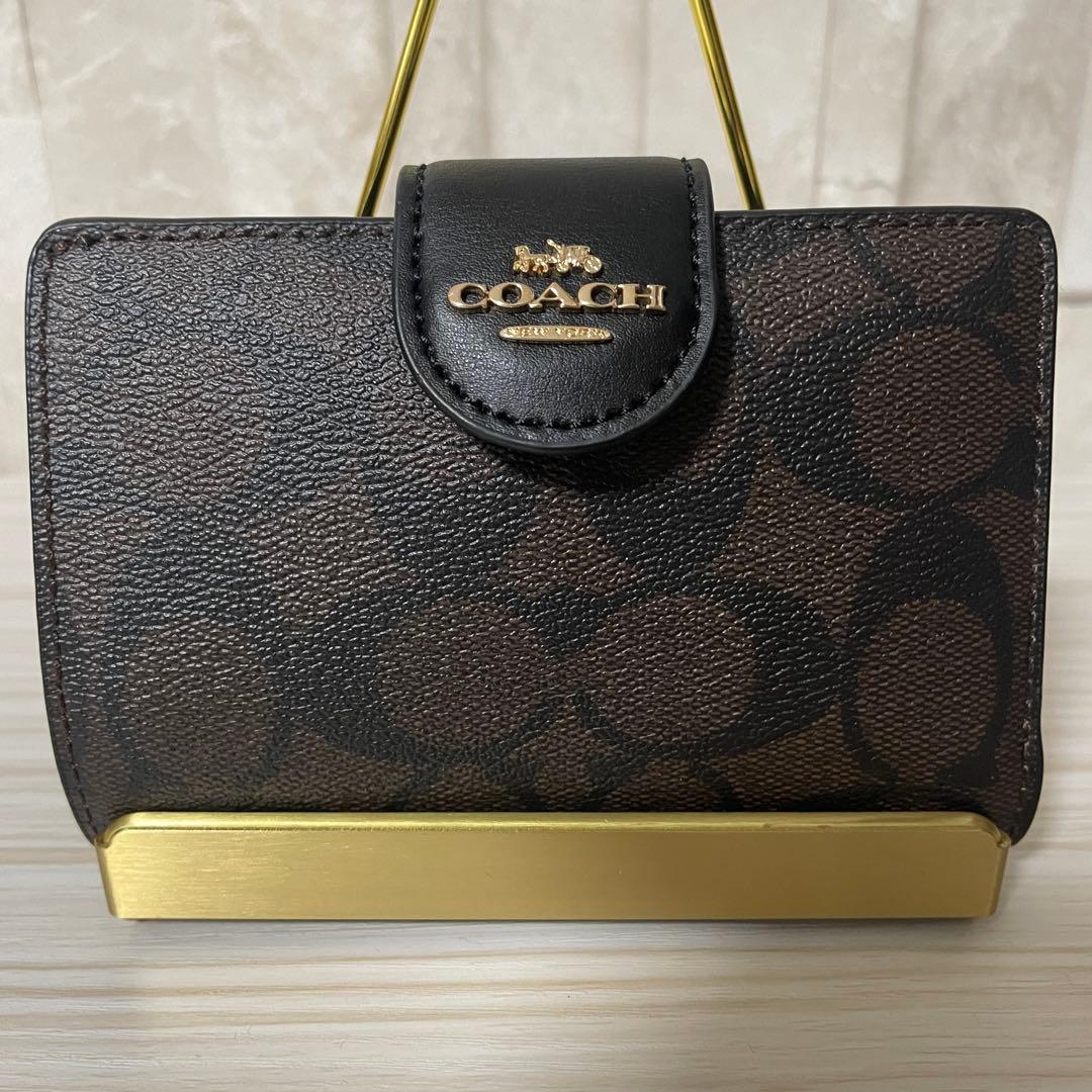 訳あり新品 COACH 二つ折り財布 シグネチャー柄 茶×黒