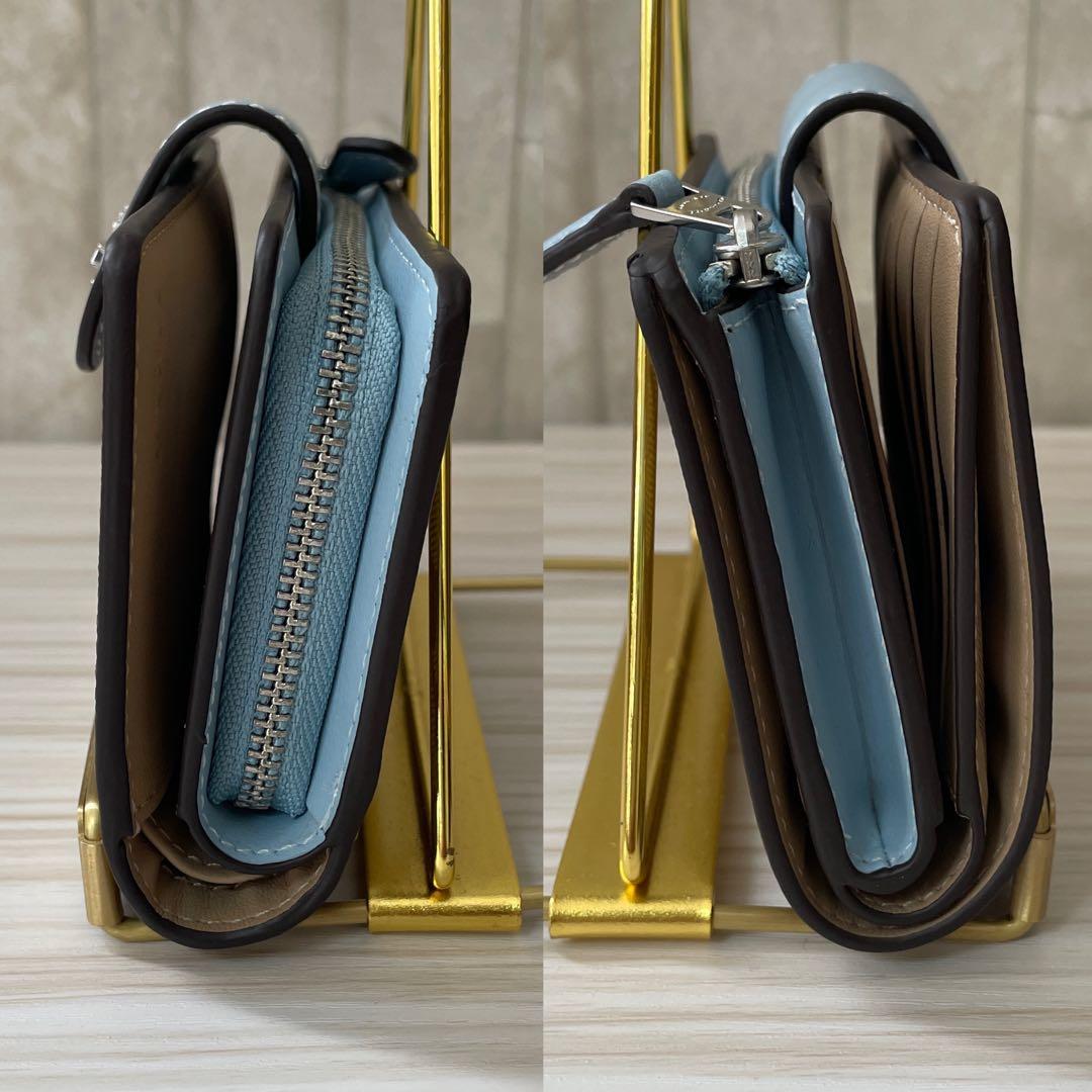 訳あり新品 COACH 二つ折り財布 シグネチャー総柄 茶色×水色