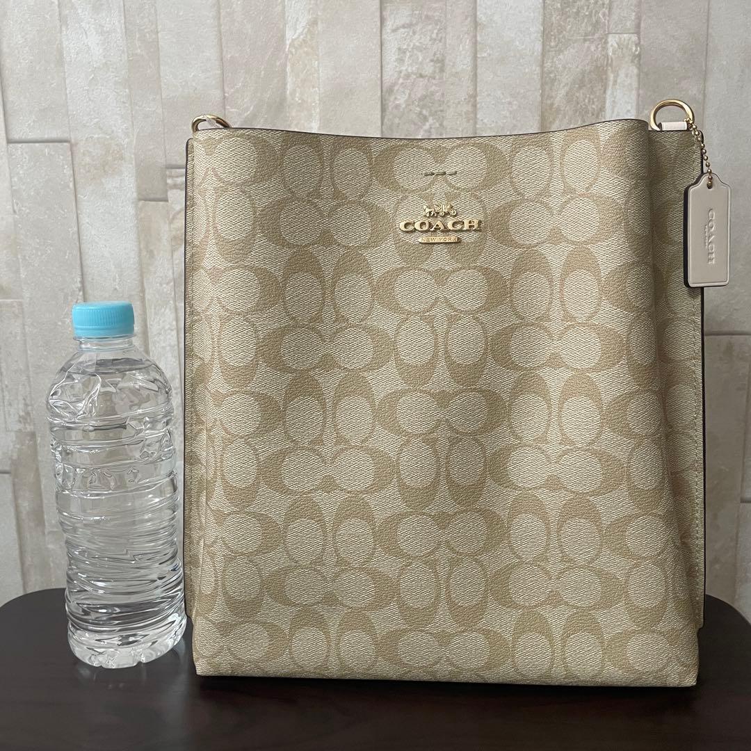 訳あり新品タグ付 COACH モリー バケットバッグ シグネチャー柄