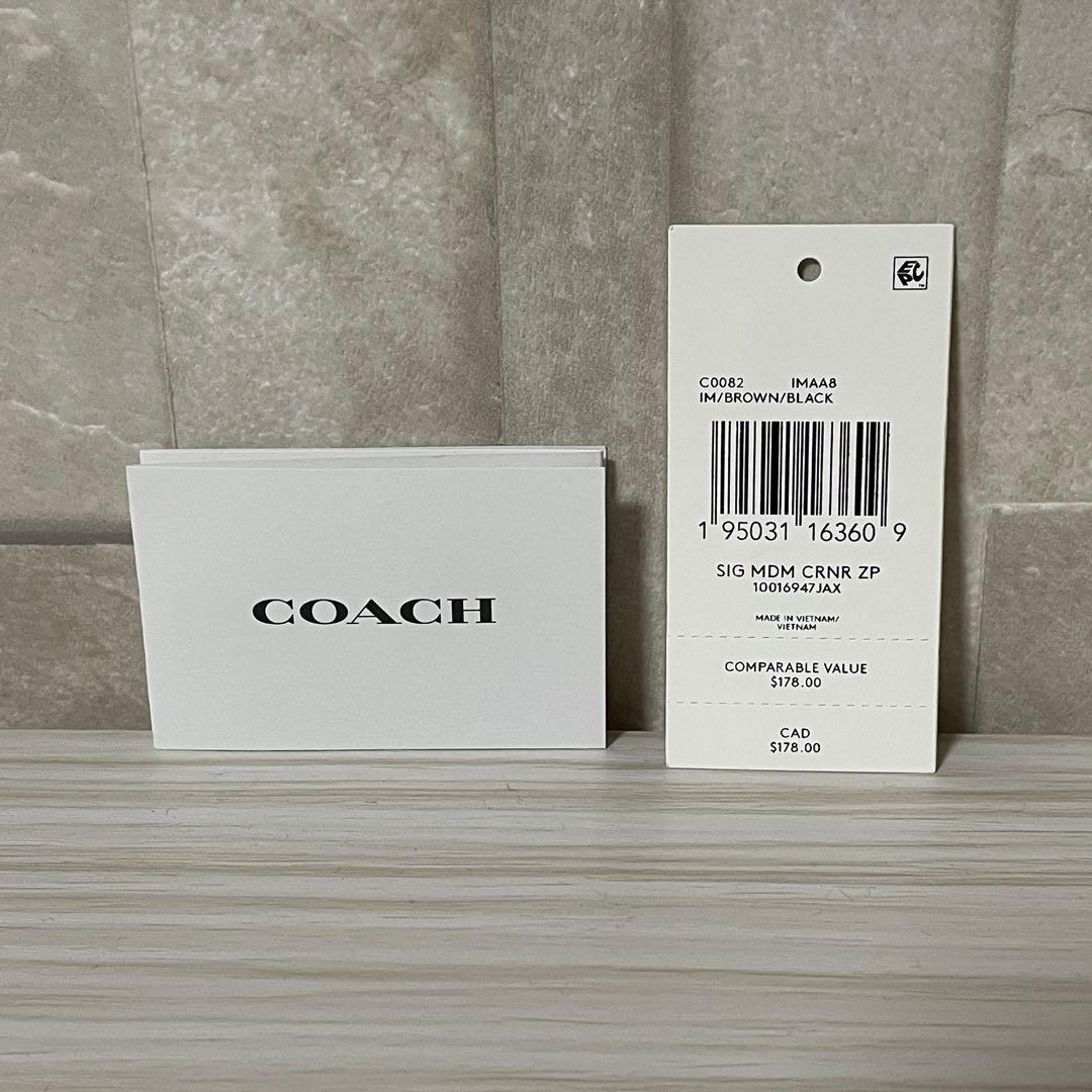訳あり新品 COACH 二つ折り財布 シグネチャー柄 茶×黒