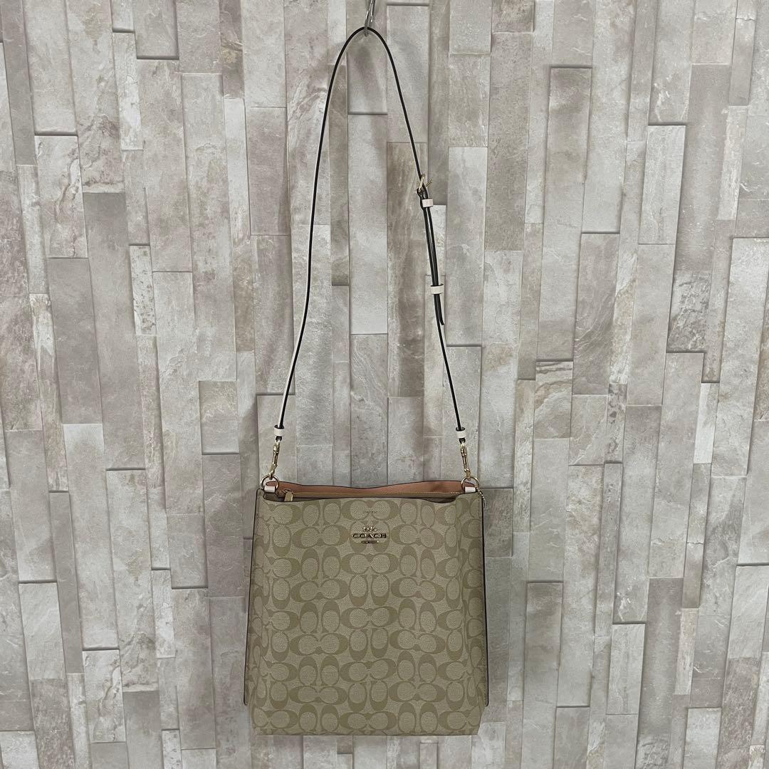 訳あり新品タグ付 COACH モリー バケットバッグ シグネチャー柄