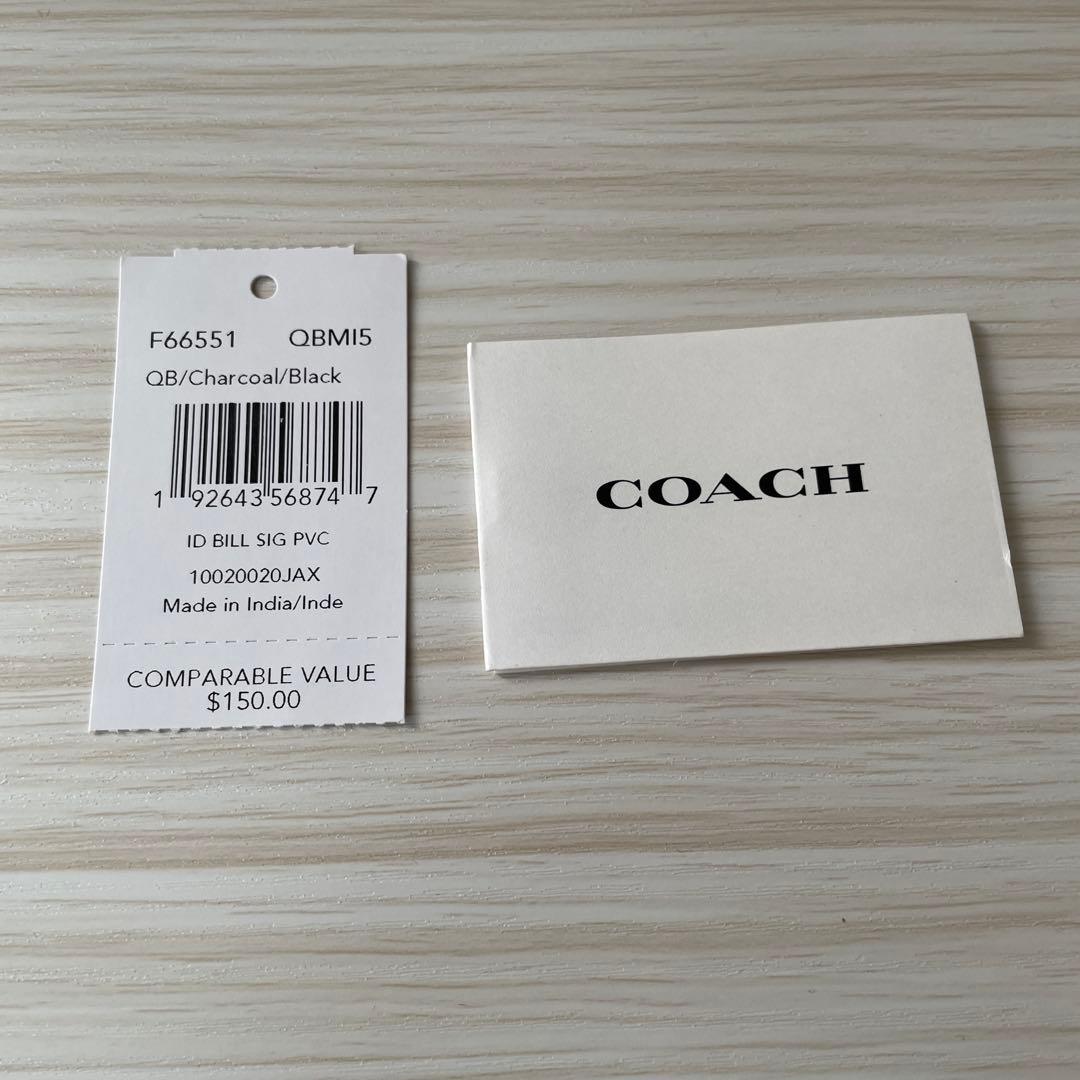 訳あり新品 COACH 二つ折り財布 シグネチャー柄 ブラック