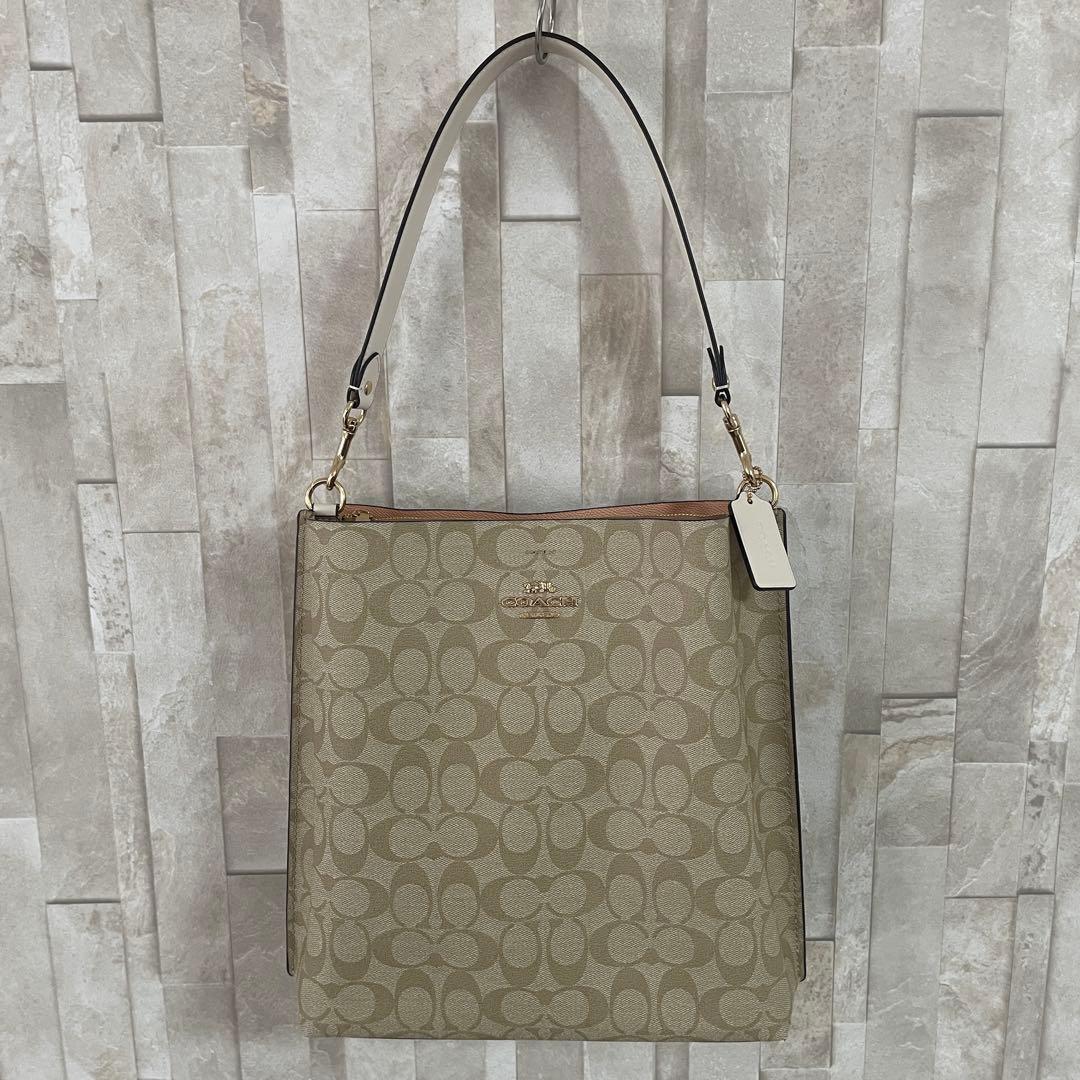 訳あり新品タグ付 COACH モリー バケットバッグ シグネチャー柄