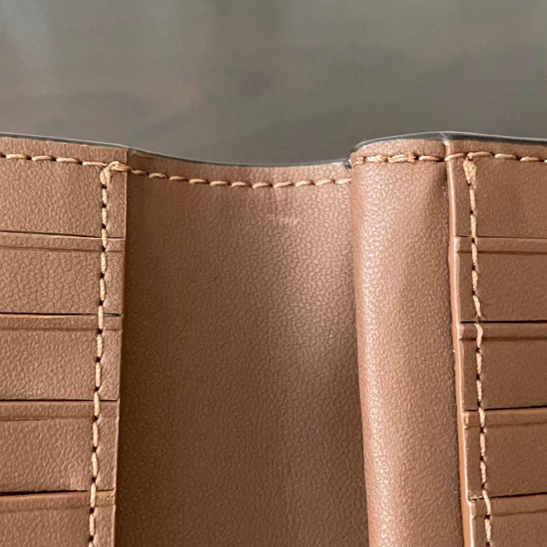 訳あり新品 COACH 二つ折り財布 シグネチャー総柄 ブラウン
