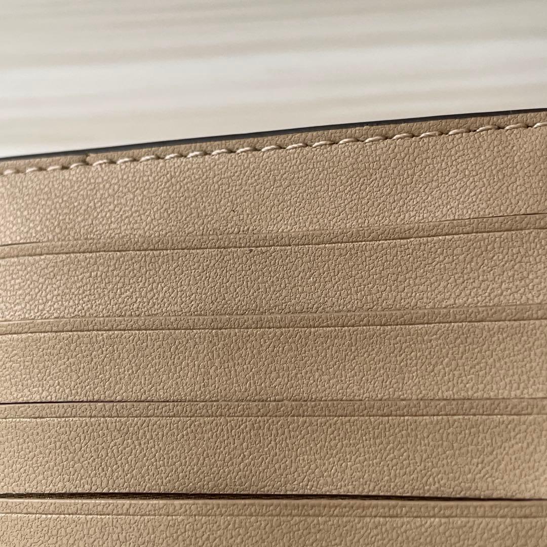 訳あり新品 COACH 二つ折り財布 シグネチャー総柄 茶色×水色