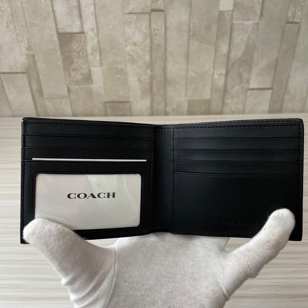 訳あり新品 COACH 二つ折り財布 シグネチャー柄 ブラック