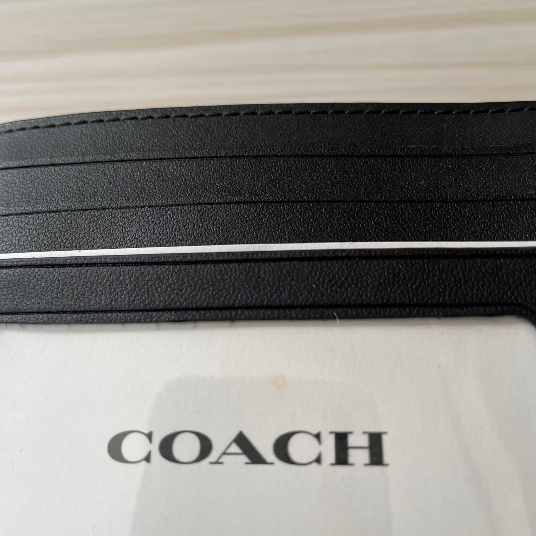 訳あり新品 COACH 二つ折り財布 シグネチャー柄 ブラック