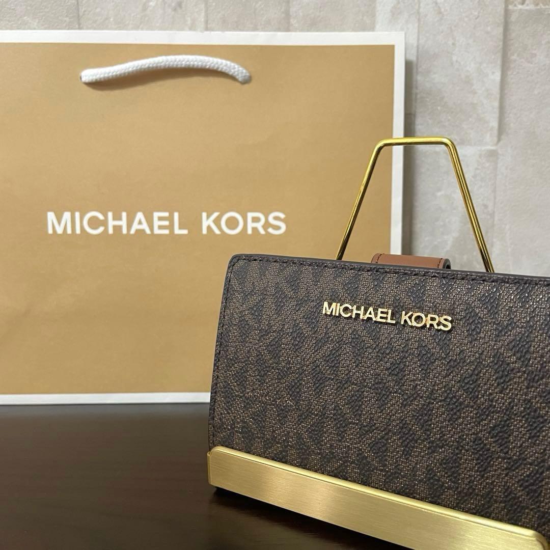 訳あり新品 MICHAEL KORS 二つ折り財布 シグネチャー柄
