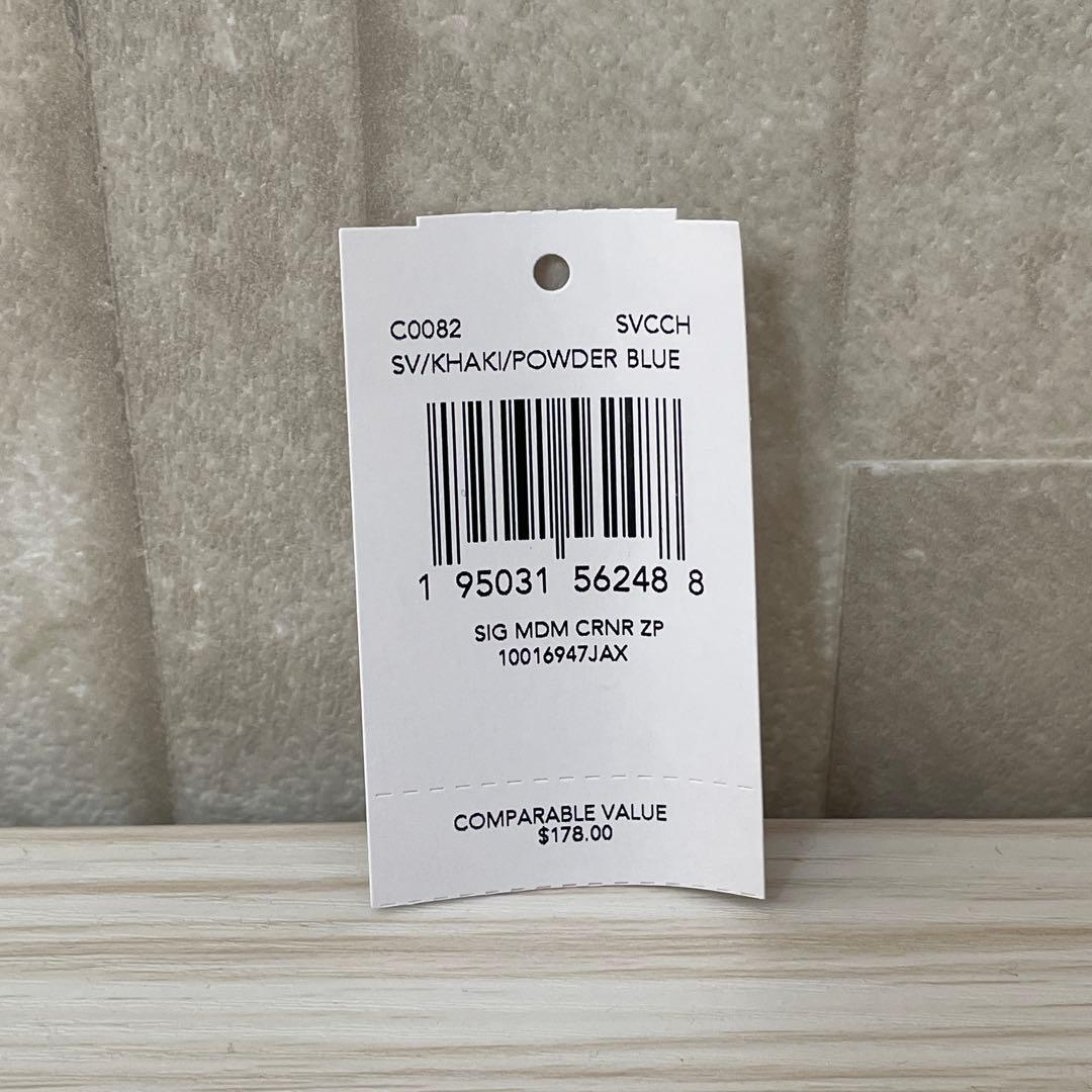 訳あり新品 COACH 二つ折り財布 シグネチャー総柄 茶色×水色