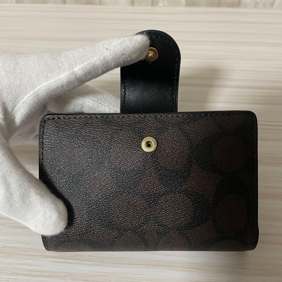 訳あり新品 COACH 二つ折り財布 シグネチャー柄 茶×黒