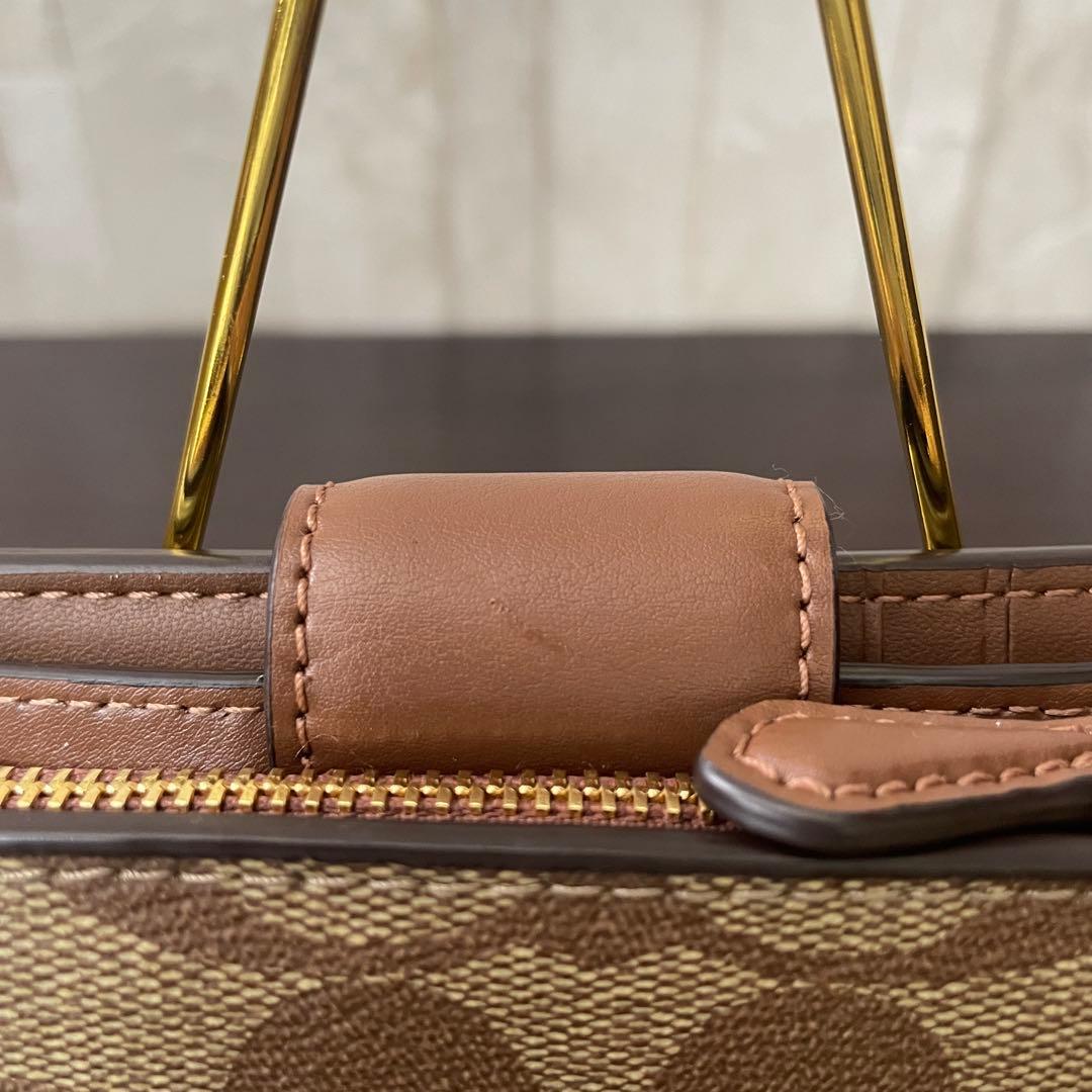 訳あり新品 COACH 二つ折り財布 シグネチャー総柄 ブラウン