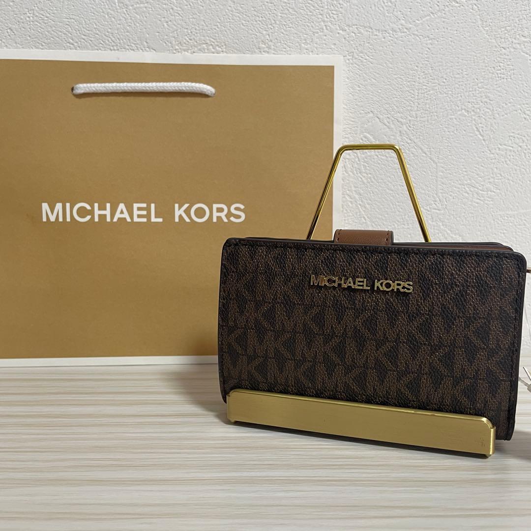 早い者勝ち！訳あり新品 MICHAEL KORS 二つ折り財布 シグネチャー柄（画像 1/12）